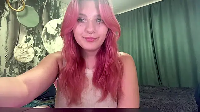 KittyMeooww - look into the camera and blow a kiss